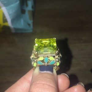 Gold cocktail ring with lime green gemstone